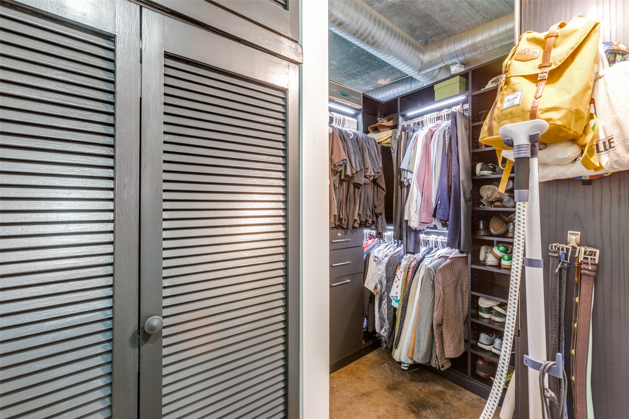 311 West 5th Street, Unit 704 Austin, TX 78701 - Photo 10 of 12 a view of walk in closet with clothes and shoes