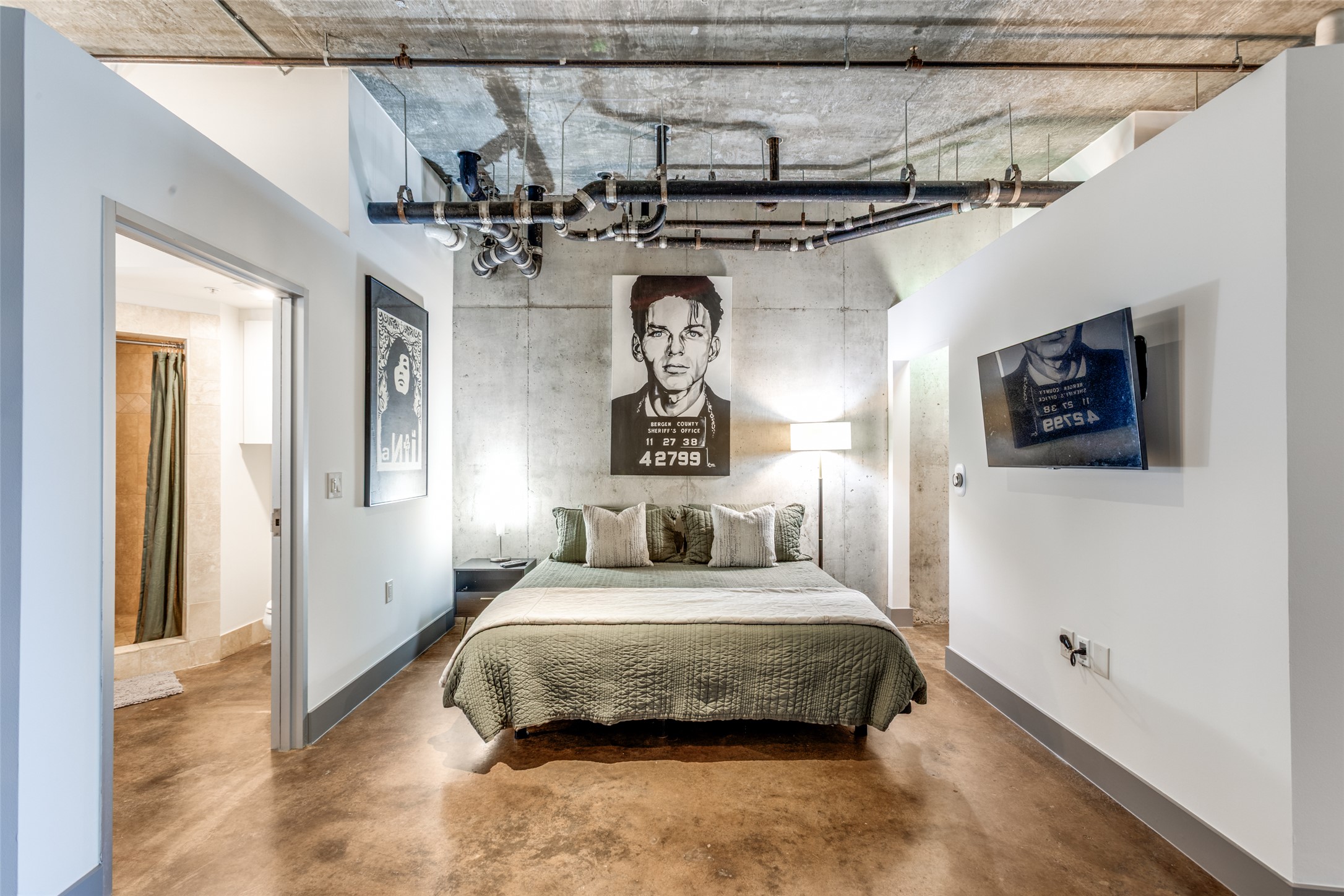 311 West 5th Street, Unit 704 Austin, TX 78701 - Photo 7 of 12 a bedroom with a bed and a chandelier