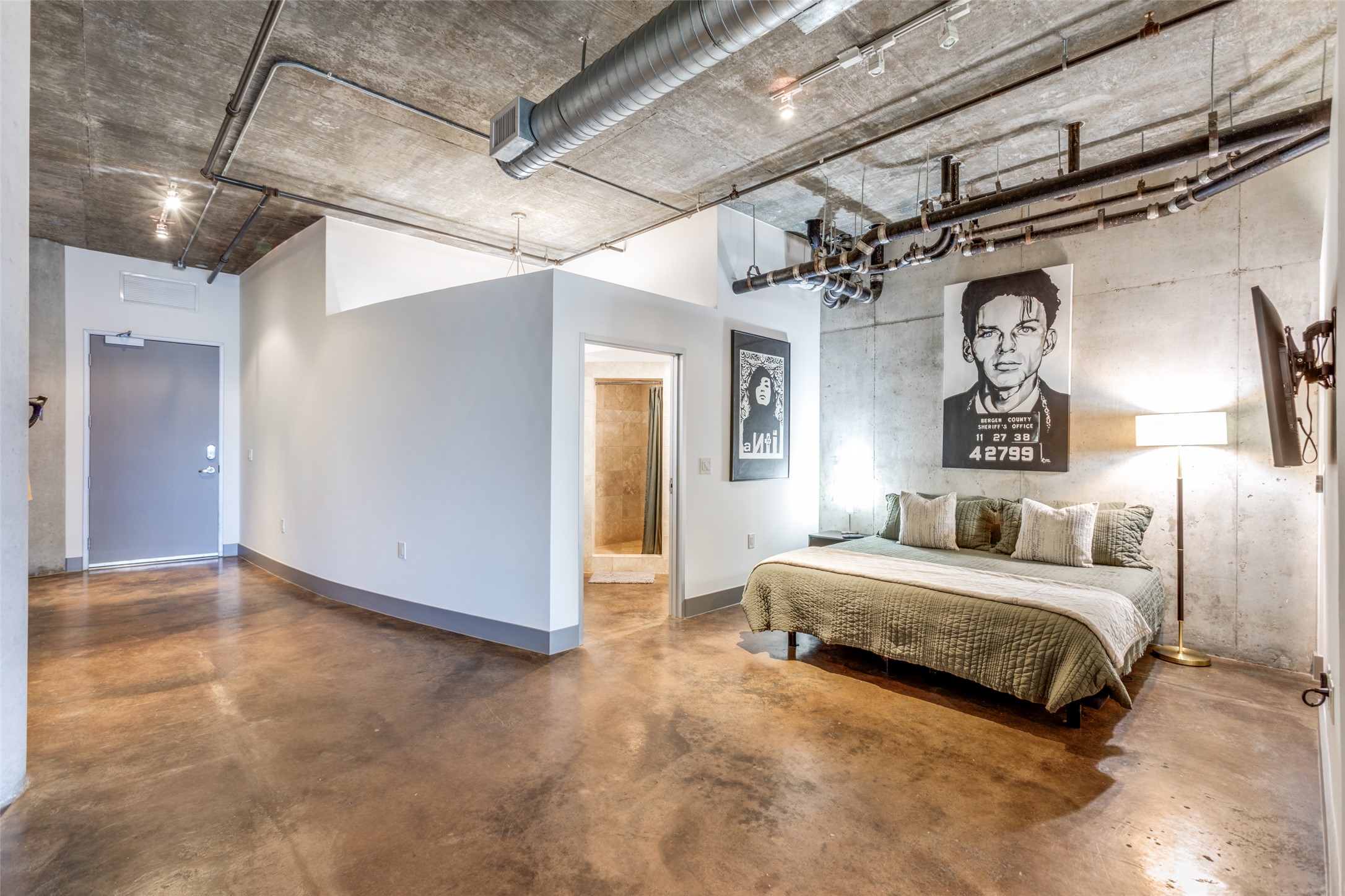 311 West 5th Street, Unit 704 Austin, TX 78701 - Photo 8 of 12 a spacious bedroom with a bed and a walk in closet