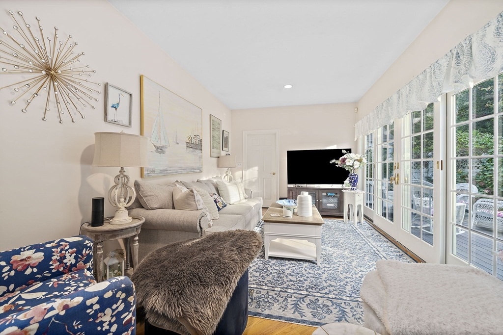 11 Forest Lane, Unit 11 Scituate, MA 02066 - Photo 11 of 42 a living room with furniture and a flat screen tv
