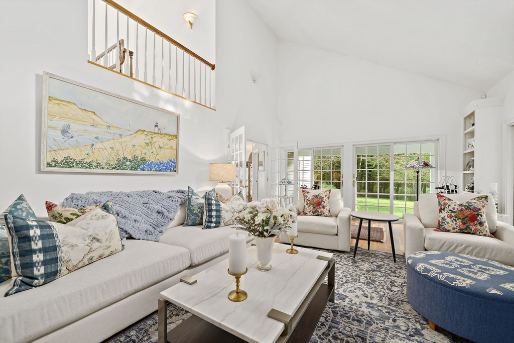 11 Forest Lane, Unit 11 Scituate, MA 02066 - Photo 17 of 42 a living room with furniture and a large window