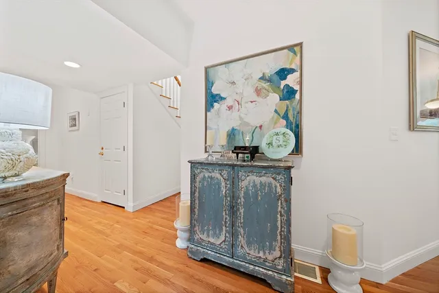 a view of a hallway with paintings on the wall