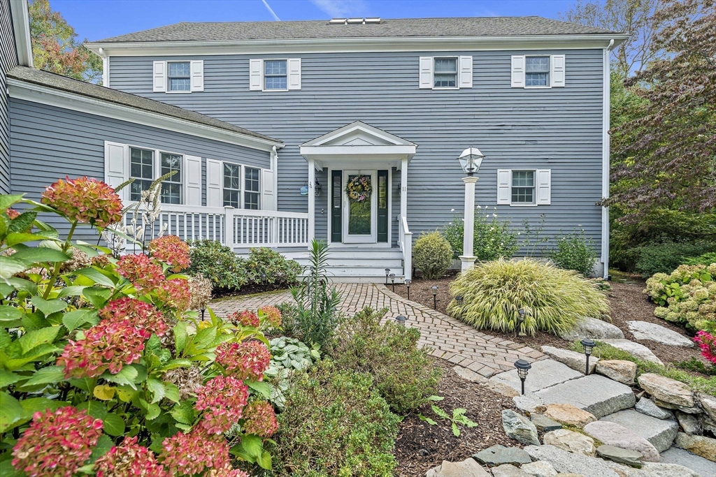 11 Forest Lane, Unit 11 Scituate, MA 02066 - Photo 2 of 42 a front view of a house
