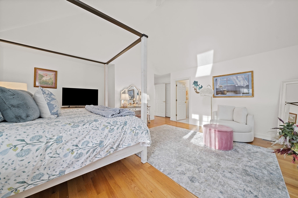 11 Forest Lane, Unit 11 Scituate, MA 02066 - Photo 26 of 42 a bedroom with a bed and a lamp