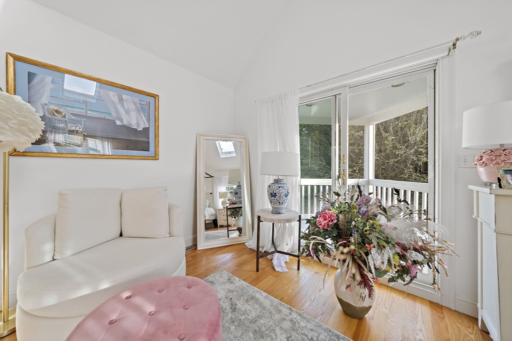 11 Forest Lane, Unit 11 Scituate, MA 02066 - Photo 27 of 42 a living room with furniture and wooden floor