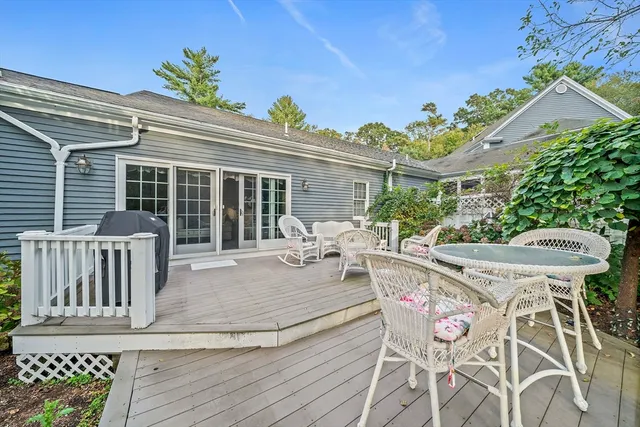a view of a patio with table and chairs and potted plants