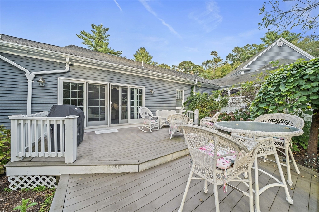 11 Forest Lane, Unit 11 Scituate, MA 02066 - Photo 36 of 42 a view of a patio with table and chairs and potted plants