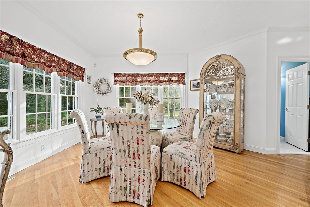 11 Forest Lane, Unit 11 Scituate, MA 02066 - Photo 8 of 42 a view of a dining room with furniture window and wooden floor