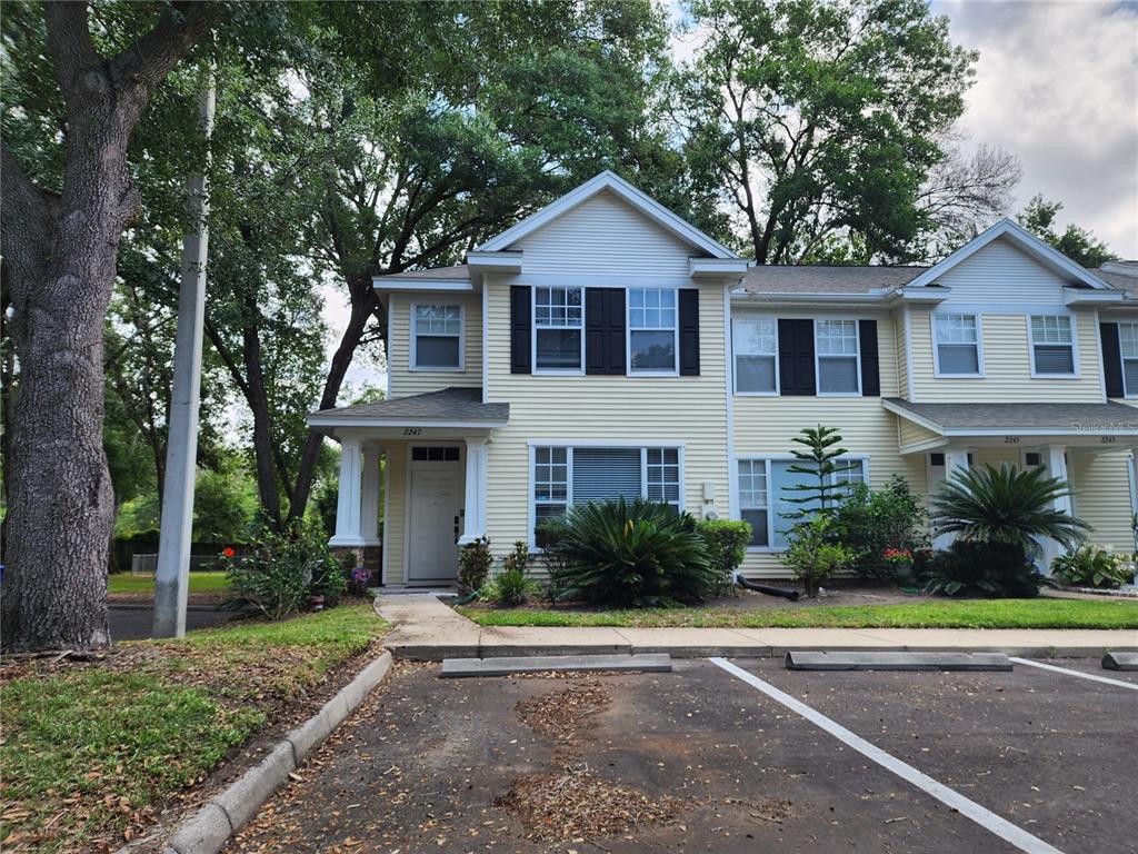 2247 Golden Oak Lane Valrico, FL 33594 - Photo 2 of 9 a front view of a house with a yard and garage