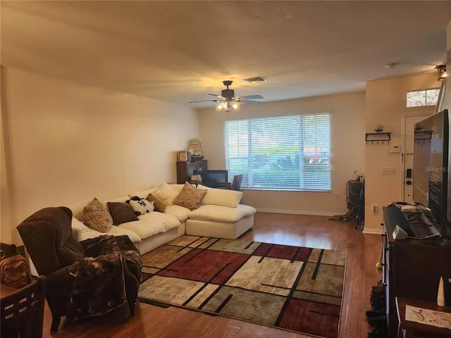 a living room with furniture and a large window