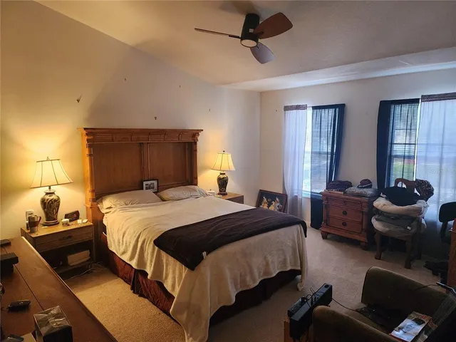 a bedroom with a bed and furniture