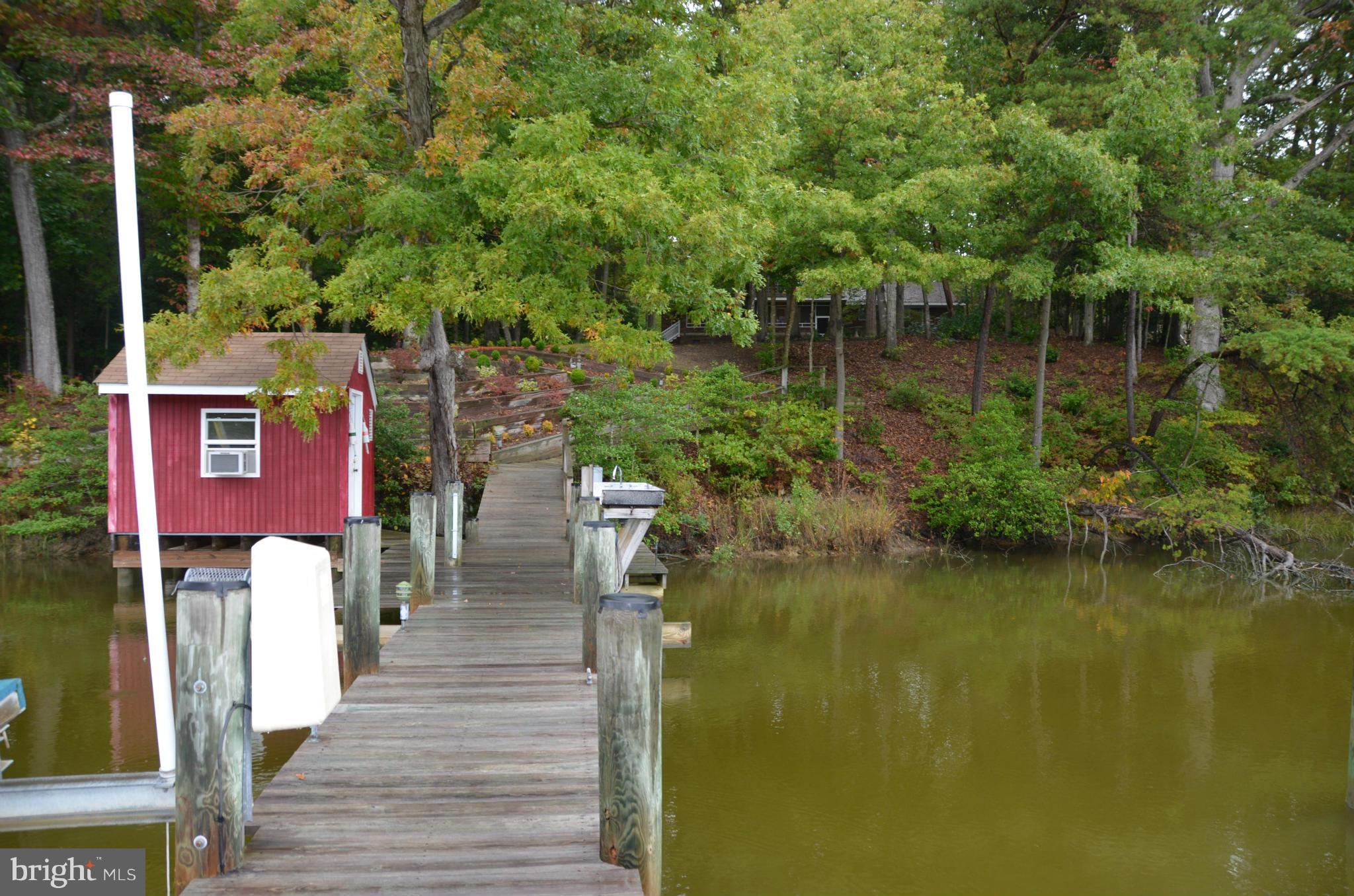 12717 Blair Road Lusby, MD 20657 - Photo 21 of 30 a view of residential house with outdoor space and lake view