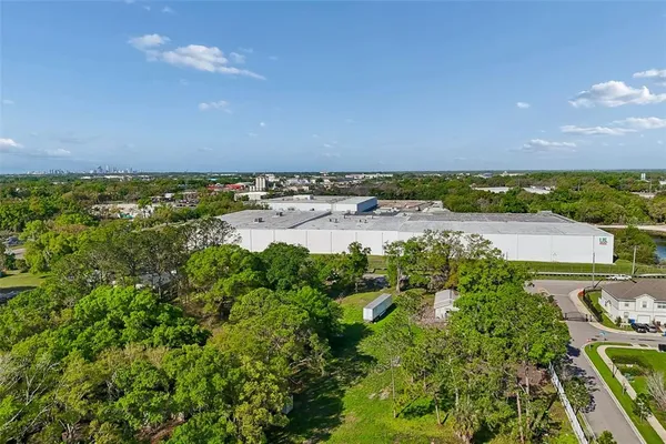 an aerial view of residential building and car parked