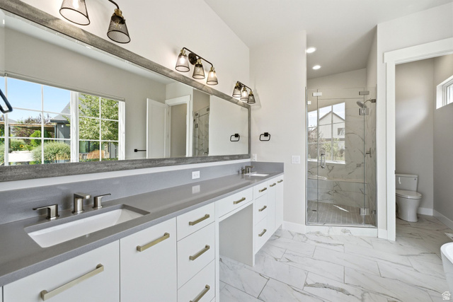496 North Farmhouse Way, Unit 11 Midway, UT 84049 - Photo 25 of 50 Bathroom featuring an extended double vanity with undermount sinks, gray countertops, and white cabinetry with gold-tone hardware