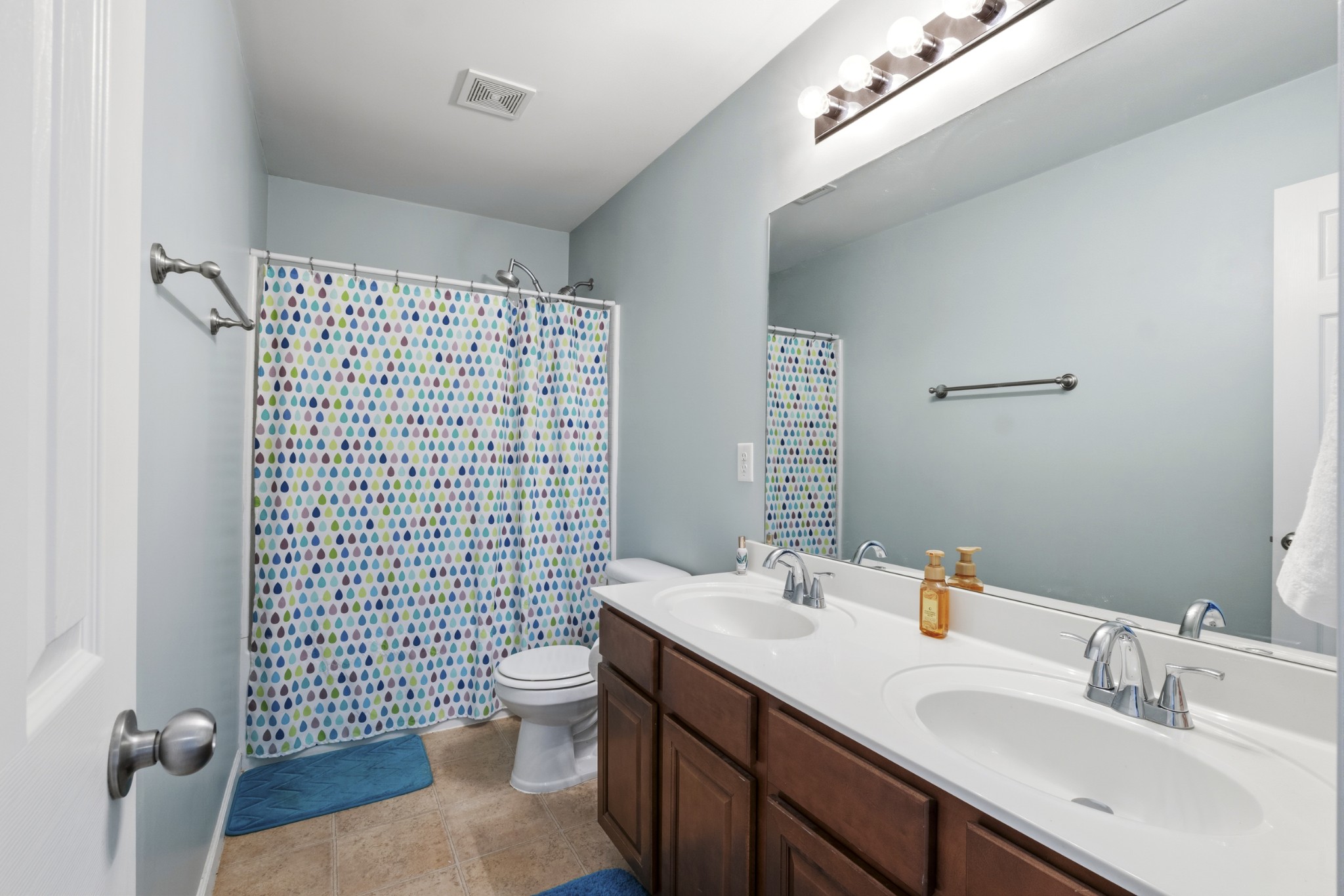 1011 Benwick Road Hendersonville, TN 37075 - Photo 34 of 60 a bathroom with a sink a toilet and shower curtain