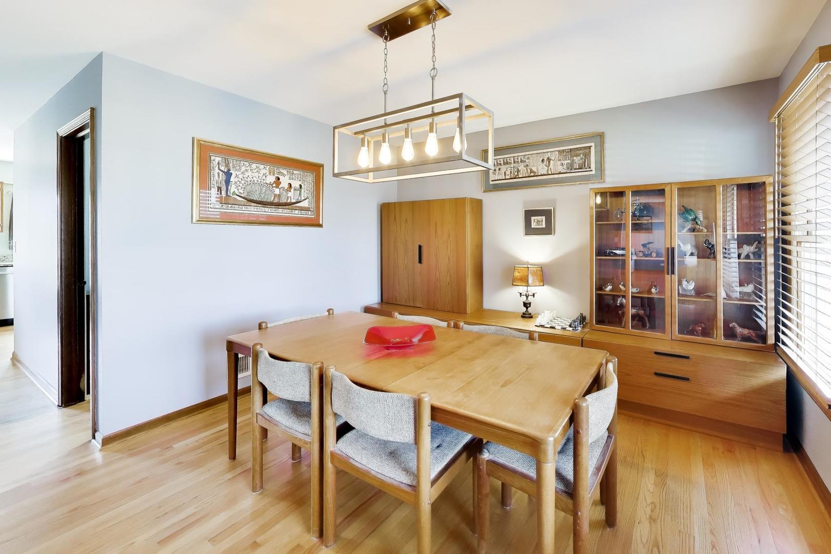 850 Tartans Drive West Dundee, IL 60118 - Photo 11 of 49 a view of a dining room with furniture and wooden floor