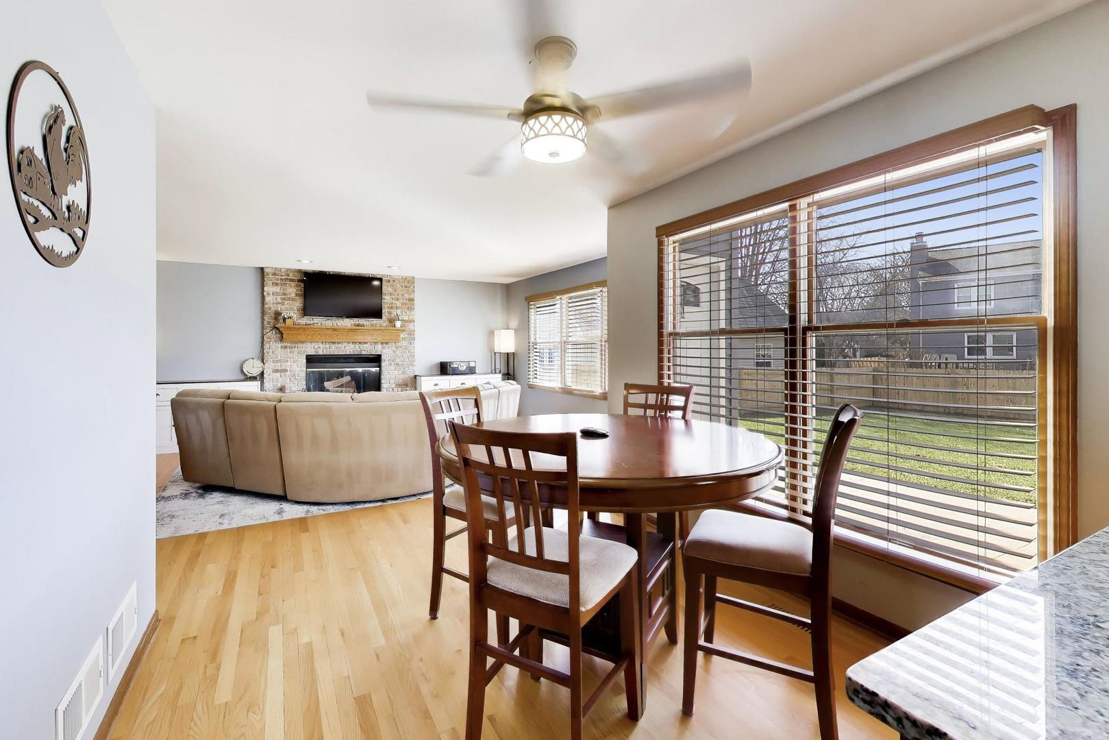 850 Tartans Drive West Dundee, IL 60118 - Photo 15 of 49 a view of a dining room with furniture window and wooden floor