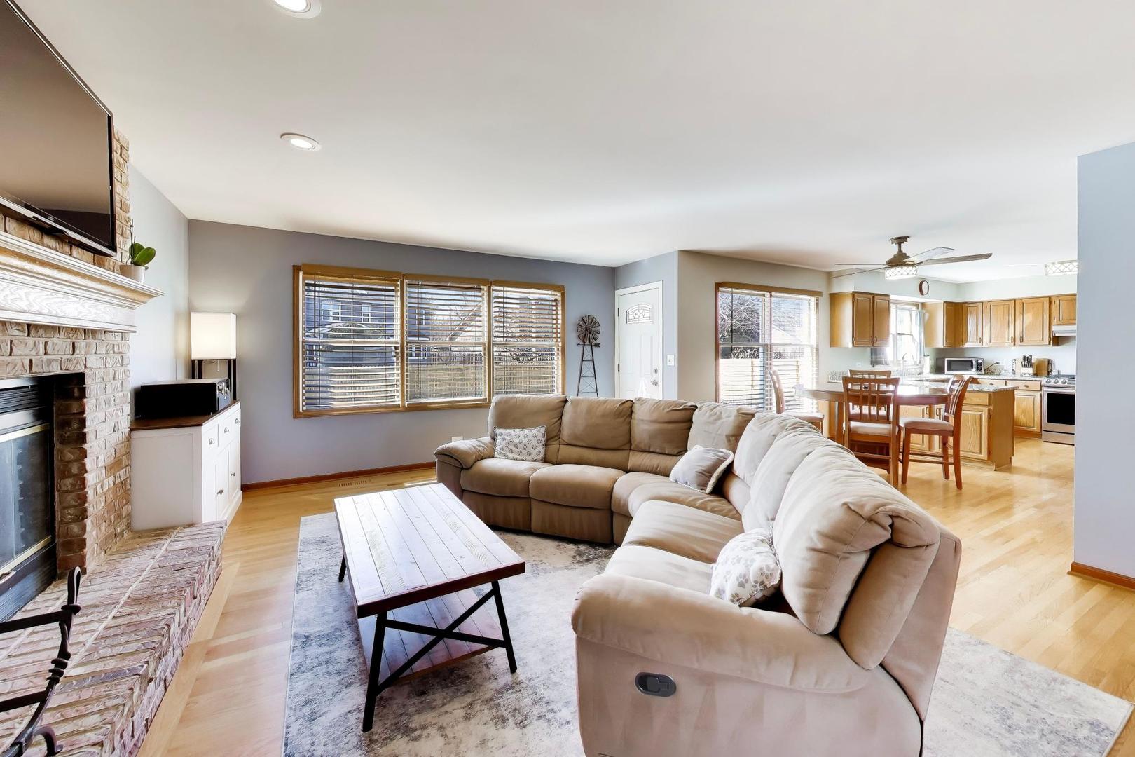 850 Tartans Drive West Dundee, IL 60118 - Photo 17 of 49 a living room with furniture large window and a flat screen tv