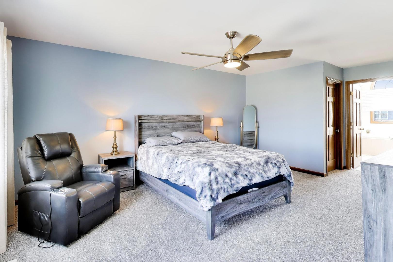 850 Tartans Drive West Dundee, IL 60118 - Photo 24 of 49 a bedroom with a bed couch and window