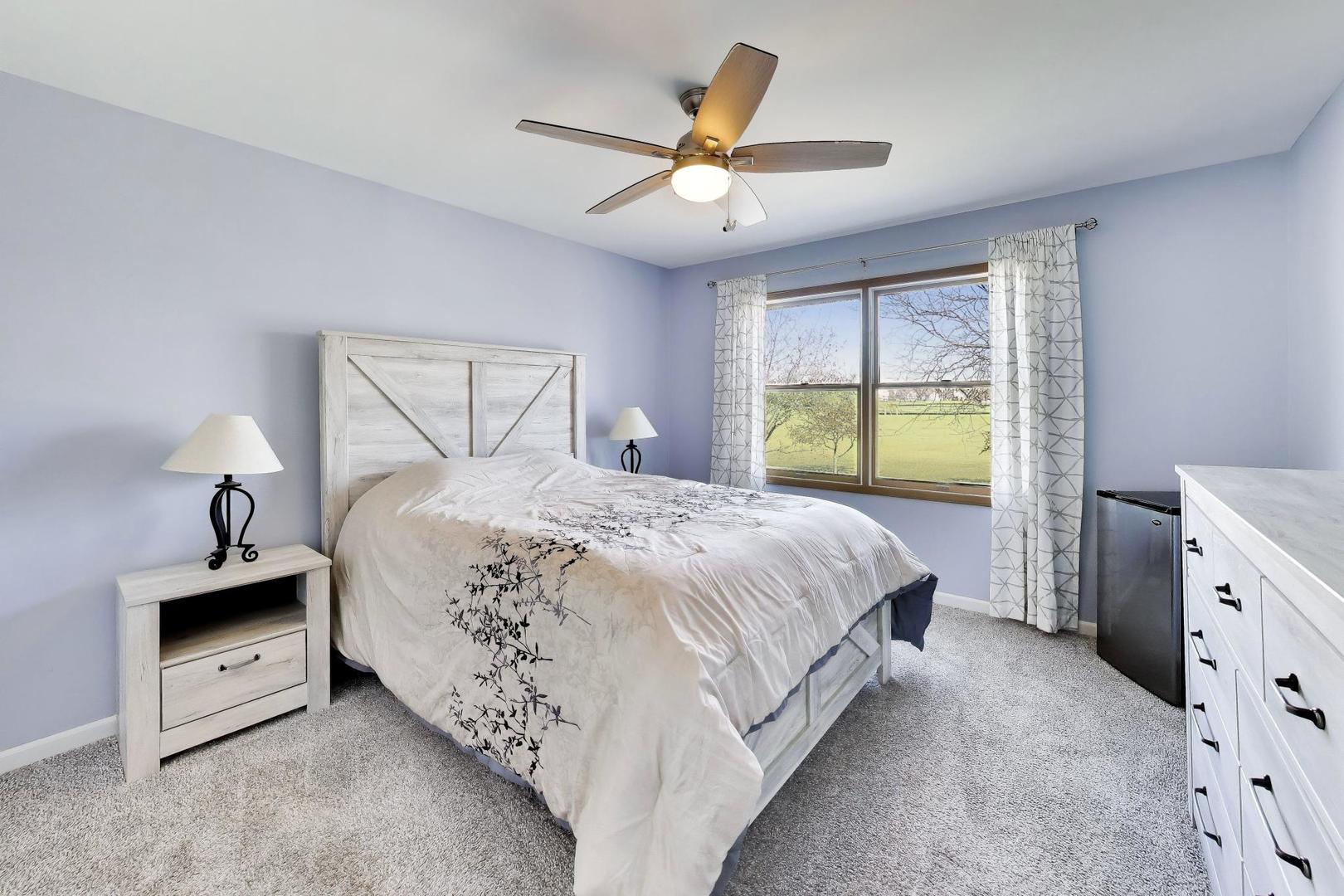 850 Tartans Drive West Dundee, IL 60118 - Photo 28 of 49 a bedroom with a bed and a window