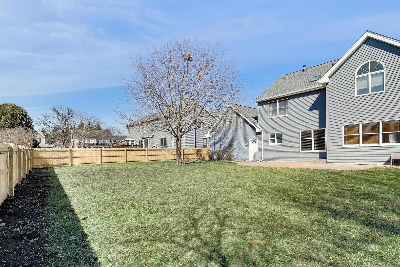 850 Tartans Drive West Dundee, IL 60118 - Photo 40 of 49 a view of a house with a yard