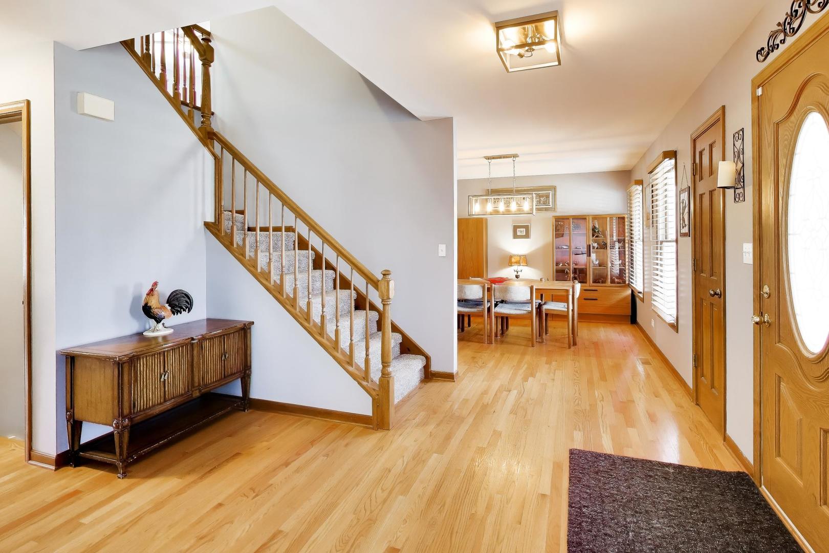 850 Tartans Drive West Dundee, IL 60118 - Photo 6 of 49 a view of entryway and hall with wooden floor