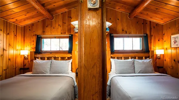 a front view of a house with large windows