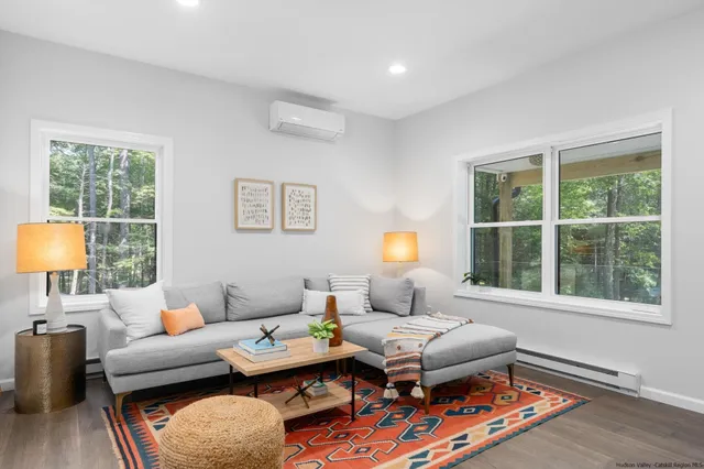 a living room with furniture and a window