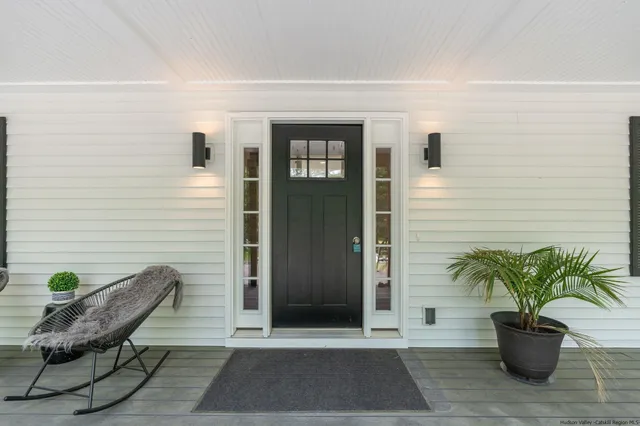a view of a wooden bench in the porch