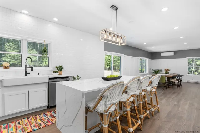 a very nice looking dining room with a table and chairs