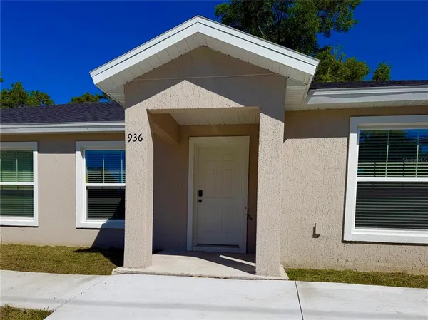 a front view of a house with a garage