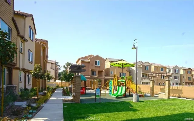 a view of a building with sitting area and furniture
