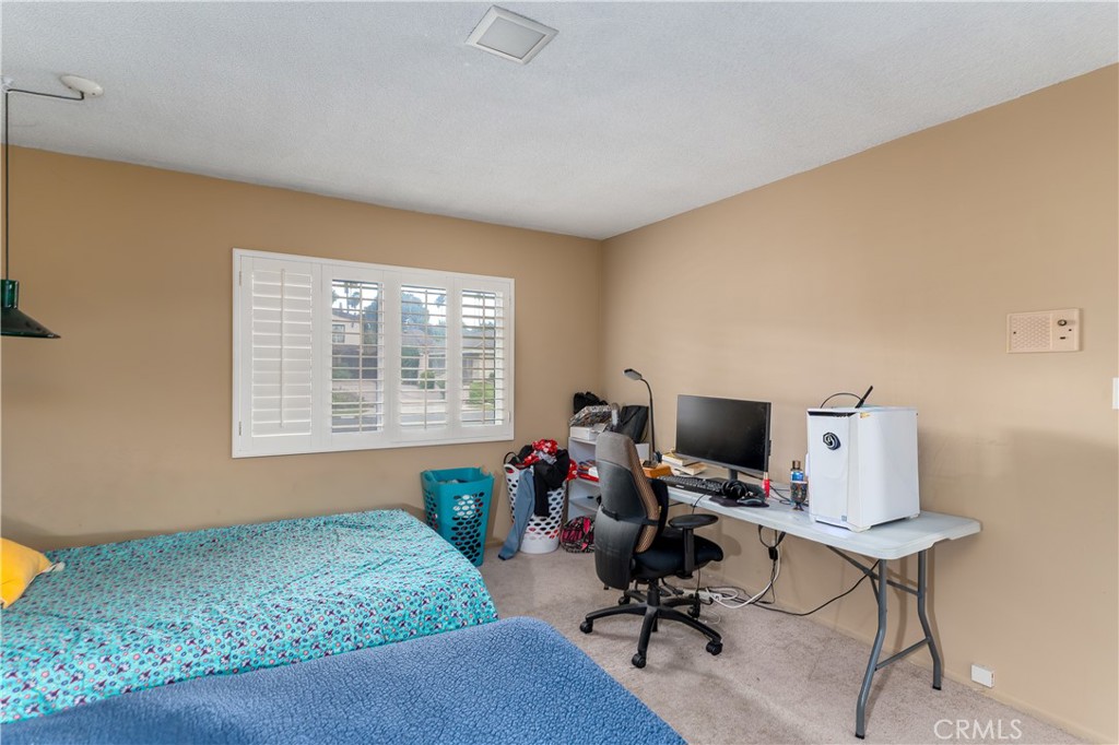 4967 Chapala Drive Riverside, CA 92507 - Photo 25 of 34 a view of a workspace with furniture and a window