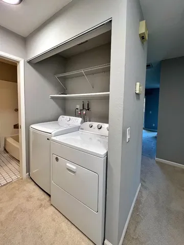 a bathroom with a sink toilet a mirror and shower