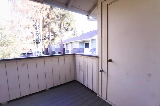 a view of balcony with a hallway