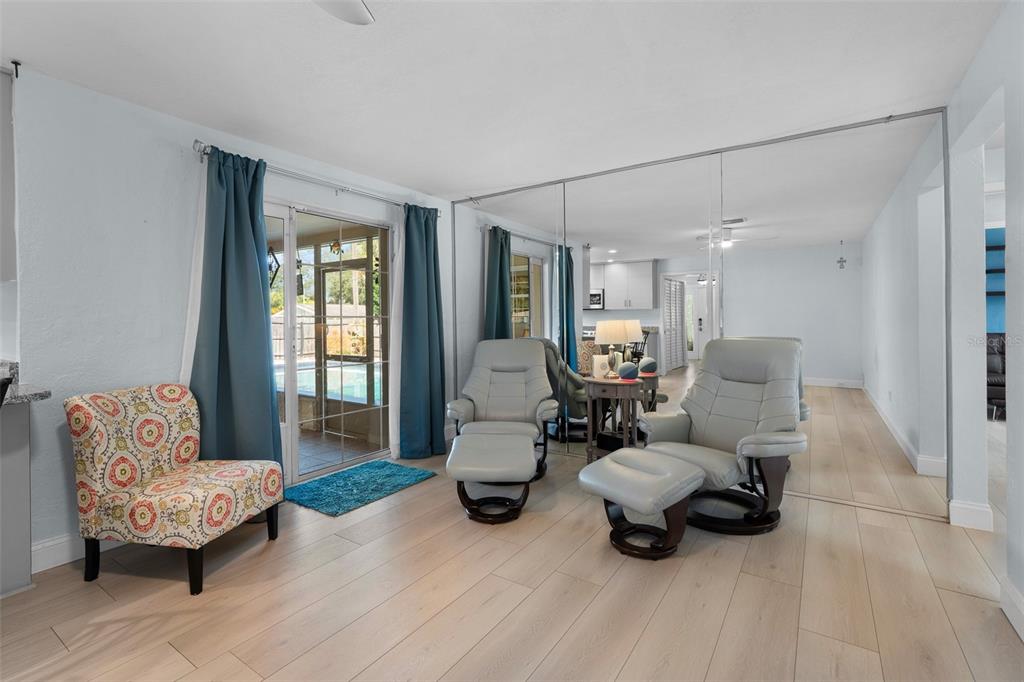 603 Ruskin Road Clearwater, FL 33765 - Photo 14 of 41 a living room with furniture and a large window