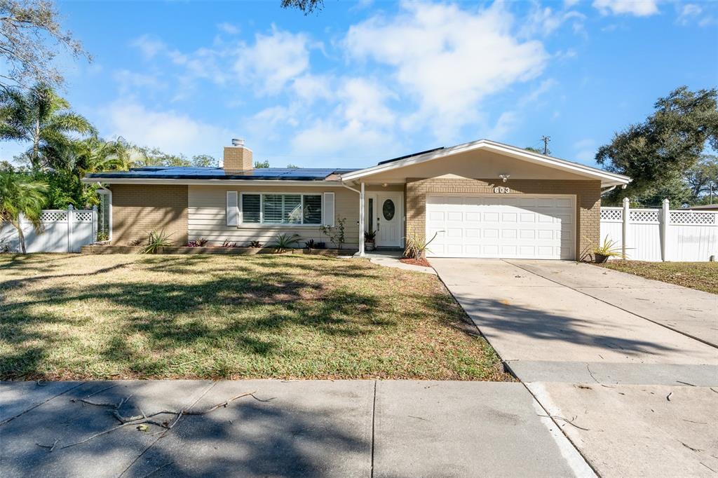 603 Ruskin Road Clearwater, FL 33765 - Photo 2 of 41 a front view of house with yard