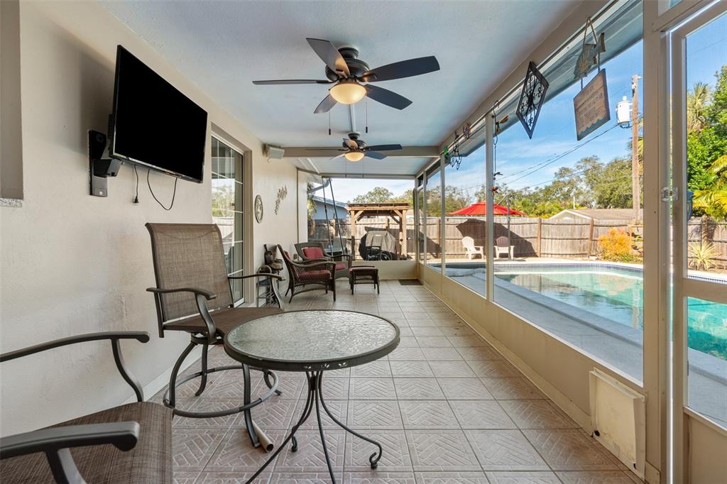 603 Ruskin Road Clearwater, FL 33765 - Photo 24 of 41 a living room with furniture and a flat screen tv