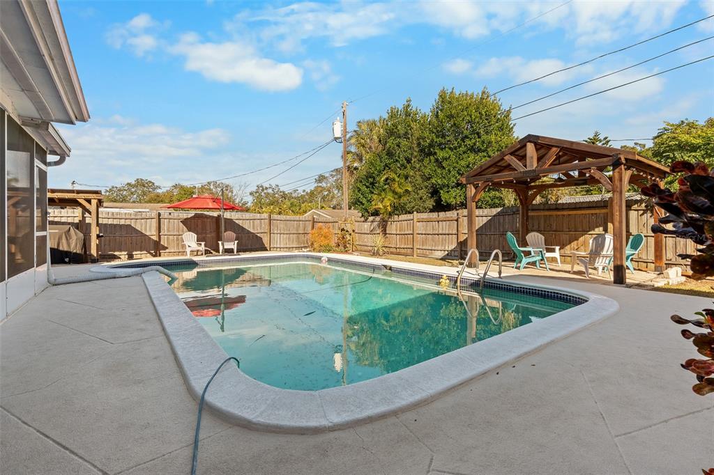 603 Ruskin Road Clearwater, FL 33765 - Photo 25 of 41 a view of a swimming pool with a terrace