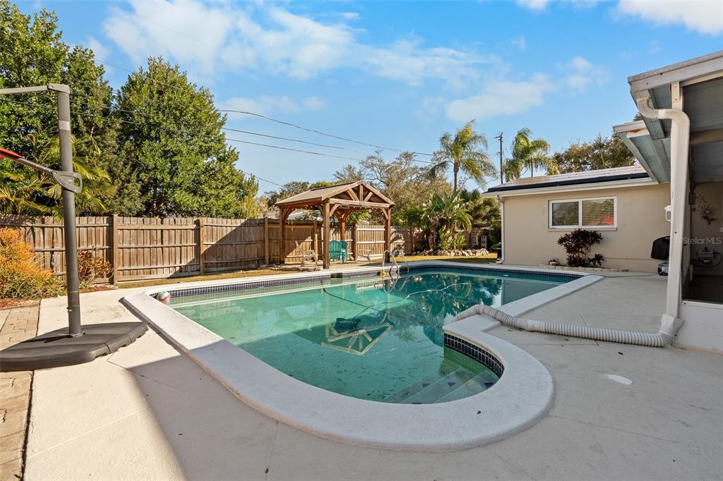 603 Ruskin Road Clearwater, FL 33765 - Photo 26 of 41 a view of a house with a backyard