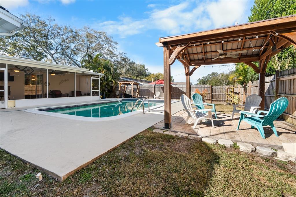 603 Ruskin Road Clearwater, FL 33765 - Photo 28 of 41 a view of a swimming pool with a patio