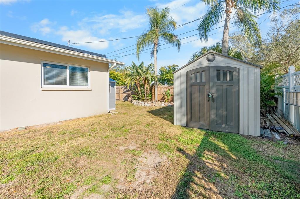 603 Ruskin Road Clearwater, FL 33765 - Photo 33 of 41 a yellow house with yard in front of it