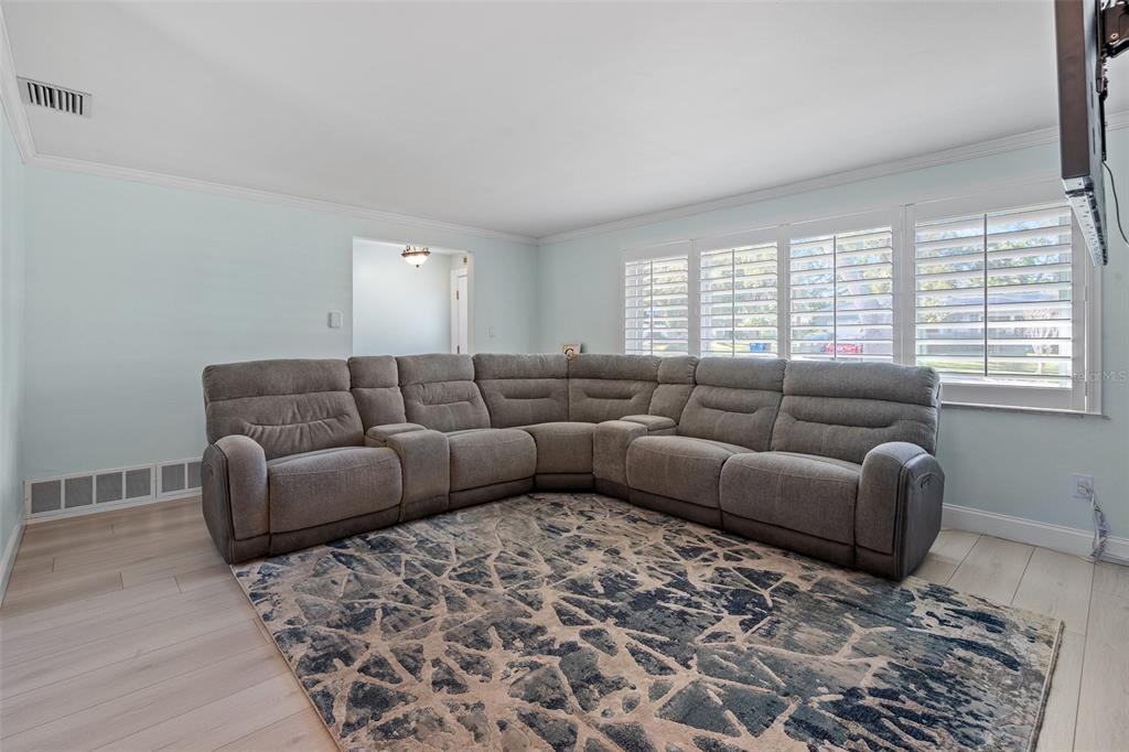 603 Ruskin Road Clearwater, FL 33765 - Photo 9 of 41 a living room with furniture and a window