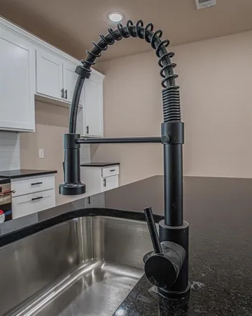 a kitchen with a sink and a stove