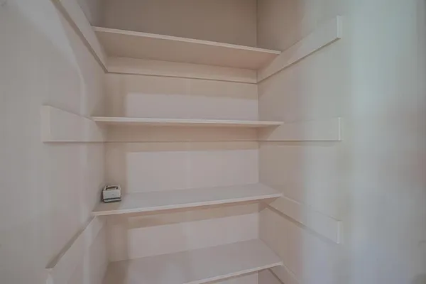 a view of an empty walk in closet