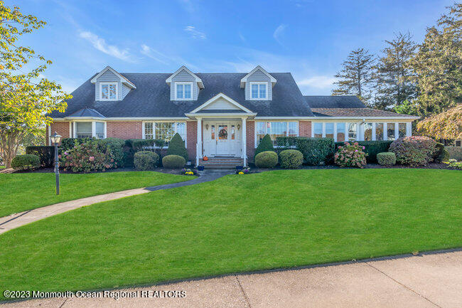 809 Lake Drive Spring Lake, NJ 07762 - Photo 1 of 34 a front view of house with yard and green space