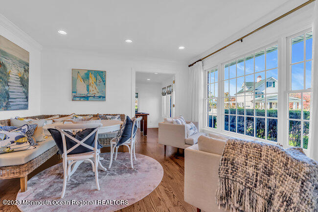 809 Lake Drive Spring Lake, NJ 07762 - Photo 11 of 34 a dining room with furniture a rug and a large window