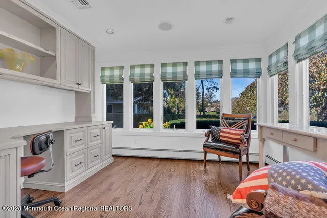 a room with furniture and a wooden floor