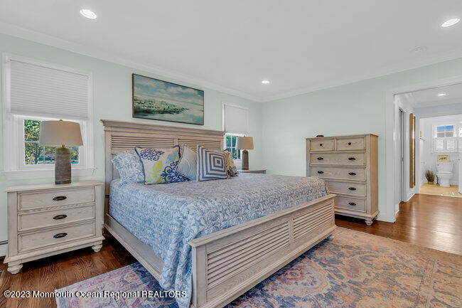 809 Lake Drive Spring Lake, NJ 07762 - Photo 16 of 34 a bedroom with a bed and furniture