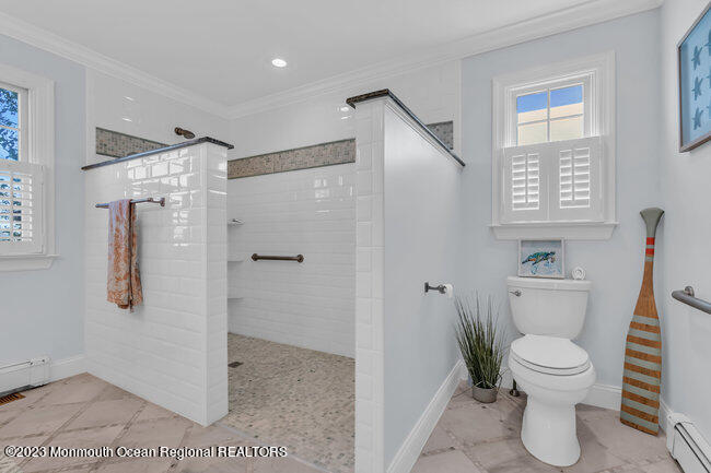 809 Lake Drive Spring Lake, NJ 07762 - Photo 18 of 34 a bathroom with a toilet and a shower